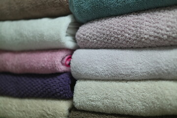 Fototapeta na wymiar Multi-colored towels neatly arranged and folded
