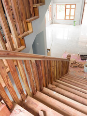 wooden stairs which the mechanic is doing meticulously and beautifully