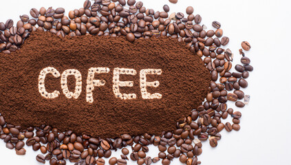 Naklejka premium Coffee beans with word Coffee isolated on white background