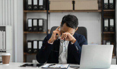 Businessman talking on the phone giving professional consultation to client or negotiating project. problems highlighting customer dissatisfaction.