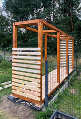 Construction of a roof and a place for drying wood for the fireplace