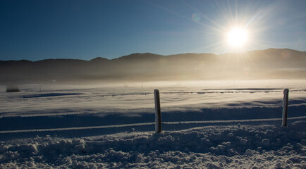 the sun rises on the Plateau frozen by the intense cold of winter