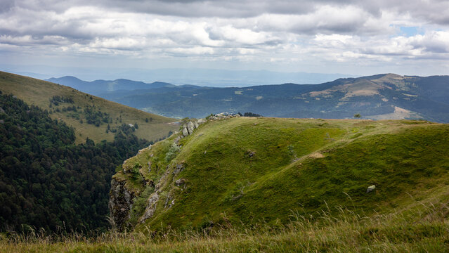 Landscape photo of the mountainous and hilly environment of the French Vosges region of Haut-rhin, taken close to the mountain named 'Grand Ballon'