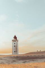 Minimalistic photo of people at sunset Rubjerg Knude Lighthouse Denmark