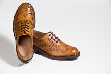 Brogue Derby Shoes of Calf Leather with Rubber Sole Over Pure White Background.