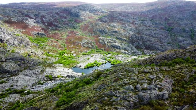 Rio tera canyon and lake water below rocky hillside glowing from sunlight