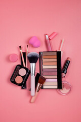 Professional makeup tools. Makeup products on pink background. A set of various products for makeup