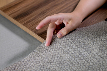 The choice of finishing materials for the design of the house project. The hand of an interior...