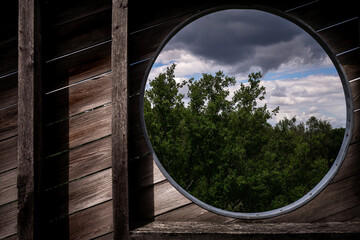 hole in a wall with a sky view