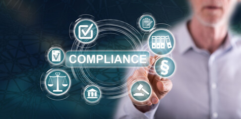 Fototapeta premium Man touching a compliance concept