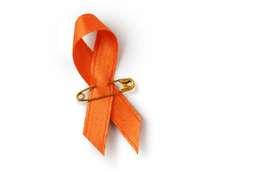 Orange ribbon with safety pin on white background - Concept of leukemia awareness, kidney cancer association, multiple sclerosis and animal abuse - 640123023