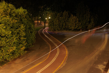 view of the night city, lights of lamps and park in the dark