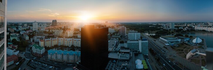 Top view of the evening city, sundown light and shadow