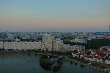 Fototapeta na wymiar Top view of the evening city, sundown light and shadow