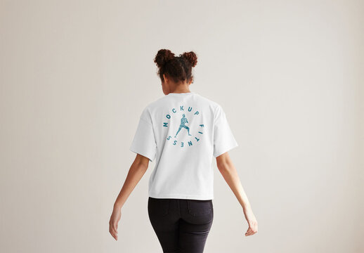 Mockup of woman wearing t-shirt with customizable color, rear view