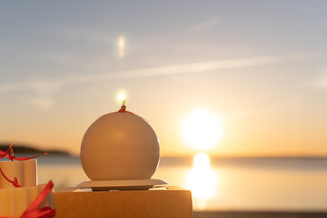 Candles against summer sunset background