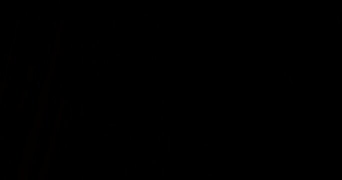 Guy man stands at window holds and closes curtains with hands. Slowly move hands and close curtains in room it will become dark