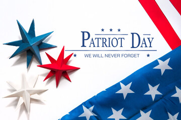 Patriot Day USA 911,Patriot day - we will never forget text on white background and stars colors of...