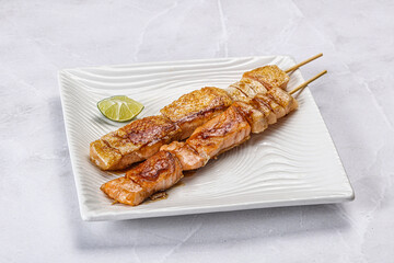 Grilled salmon skewer with sauce