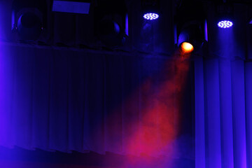 scene, stage light with colored spotlights and smoke