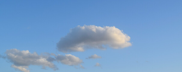 Peaceful blue sky with light clouds