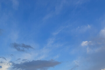 Peaceful blue sky with light clouds