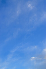 Peaceful blue sky with light clouds