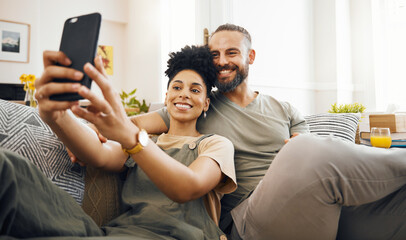 Interracial couple, selfie and happy on couch, relax at home with social media, streaming and...