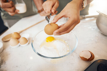 Hands with fork, crack egg and cooking in kitchen on bowl on table in home. Food, bakery and break...