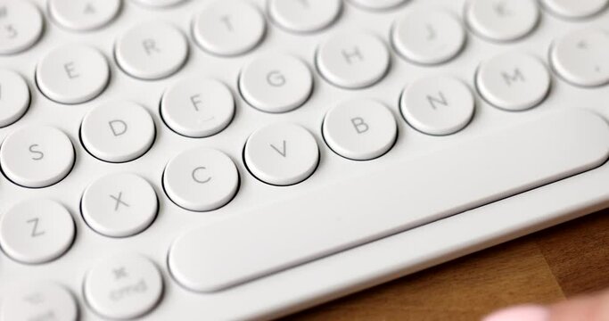 Typing on computer keyboard keys and space bar. User presses spacebar on english pc keyboard