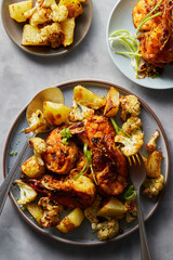 Top view of fried prawns with garlic, potato and cauliflower. 