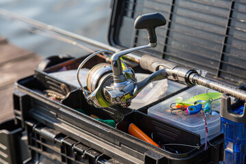 A large fisherman's tackle box fully stocked with lures and gear for fishing.fishing lures and...