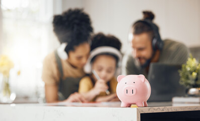 Piggy bank, table and parents with kid, learning or writing with headphones, online course or saving advice. Mom, dad and child for education, investment or help for future in interracial family home