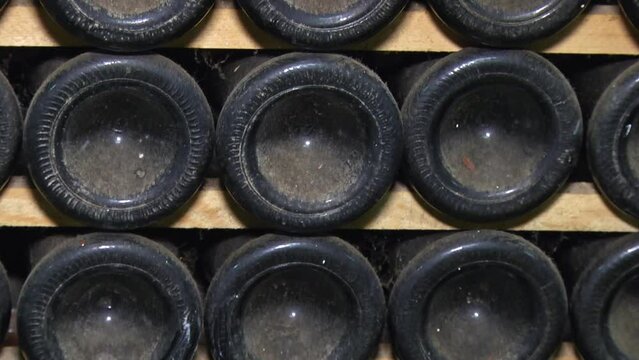 Old Aged Wine Bottles Storage in Dark Rustic Cellar Basement