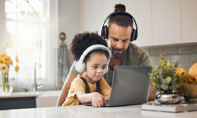 Father, child and laptop with headphones, home or happy for movie, music or streaming subscription. Dad, kid and computer for education, learning or help for online course in interracial family house