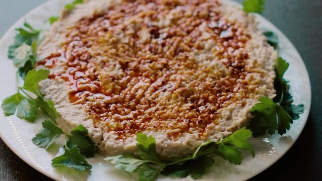 Circassian chicken, sauce and walnuts are added to the appetizer