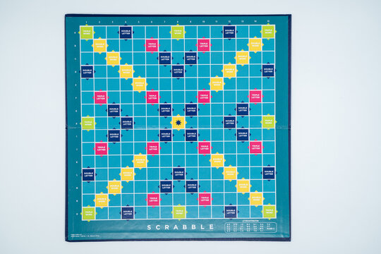Scrabble game board isolated on white background. Ankara, Turkey - August 25, 2023.