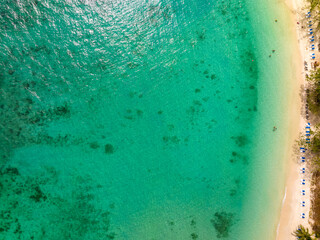 Summer sea nature background,Aerial view of Waves crashing on sandy shore,Sea surface ocean waves background