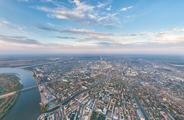 Astrakhan, Russia. Panorama of the city from the air in summer. Volga river. Sunset time. Aerial view