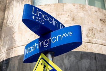 Miami Beach, Florida, USA - A blue signage showing the intersection of Lincoln Road and Washington...