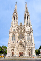 August 5, 2023, Austria, Vienna. Facade of a gothic cathedral with two towers and construction machinery