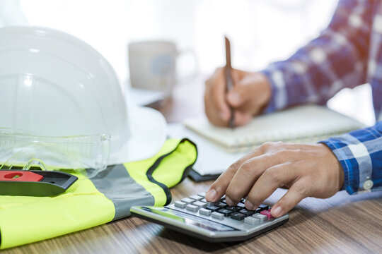 revenue calculation engineer construction costs on the desk.concept of capital analysis Recurring income and expenditure.selective focus