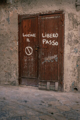 Typical old wooden door of the old Taranto suburb with 