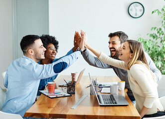 businessman businesswoman success young business team high five support unity celebrating give me five  office startup partnership diversity