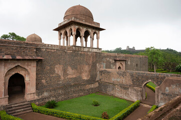 Baz Bahadur's Palace, built on the hill slope to the east of the Rewa Kund which was frequently...