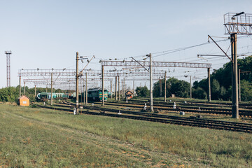 Passenger train moves fast at sunset time.