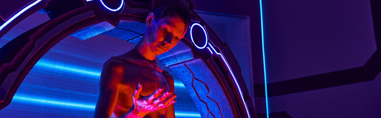 futuristic science center, humanoid alien looking at hand near experimental device, banner