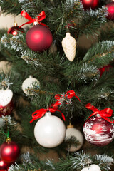 Christmas tree with red decor, closeup view