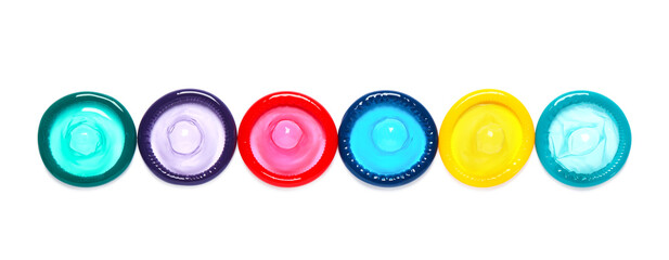 Colorful condoms isolated on white, top view. Safe sex
