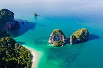 Railay Beach Krabi Thailand, the tropical beach of Railay Krabi, view from a drone of idyllic Railay Beach in Thailand in the evening at sunset with a cloudy sky
